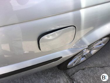 BMW fuel filler door emergency release tab